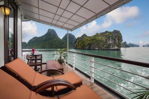 a balcony on a cruise ship looking out on the water at Orchid Trendy Cruise in Ha Long
