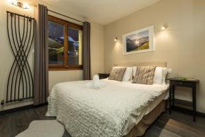 a bedroom with a bed and a window at Chalet Aigle Royal in Chamonix