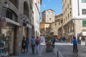 a group of people walking down a city street at Loft Vasari in Florence