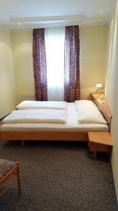 Letto o letti in una camera di CenterCourt Hotel