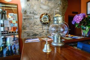 a glass trophy on top of a wooden table at Casona de Llanorrozo Apartamentos Rurales in Oviñana