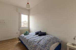 מיטה או מיטות בחדר ב-Casa Stretti by Welc(H)ome