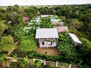 an overhead view of a house in the middle of a forest at Battambang Dream Bungalows in Battambang
