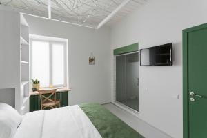 Ένα ή περισσότερα κρεβάτια σε δωμάτιο στο City Hotel Bortoli by Ribas