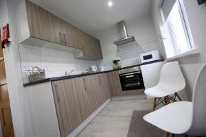 Kuchyň nebo kuchyňský kout v ubytování Hotel 52 Stanley