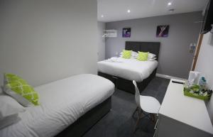 Postel nebo postele na pokoji v ubytování Hotel 52 Stanley