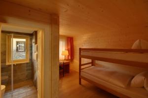 Letto o letti in una camera di Schatzalp Hotel