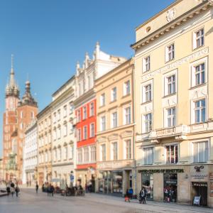 a group of buildings on a city street at Venetian House Market Square Aparthotel in Krakow