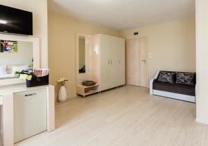 a large living room with a couch and a table at Hotel Capri in Plovdiv