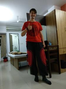 a man standing in a room in a room at Hotel Pariwar in Aurangabad