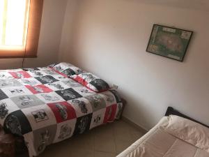 Postel nebo postele na pokoji v ubytování Hostal Casa Lantana