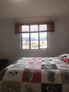 Postel nebo postele na pokoji v ubytování Hostal Casa Lantana
