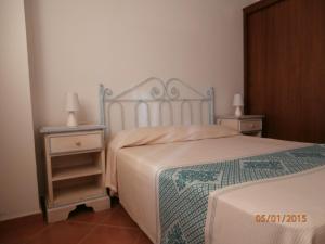 En eller flere senge i et værelse på Casa Gallo