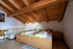 A bed or beds in a room at Pension Mirandola