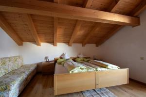 A bed or beds in a room at Pension Mirandola