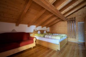 A bed or beds in a room at Pension Mirandola