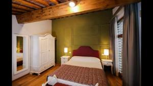 Postel nebo postele na pokoji v ubytování Agriturismo Casanova di Nardini