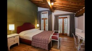 Postel nebo postele na pokoji v ubytování Agriturismo Casanova di Nardini