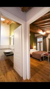 Postel nebo postele na pokoji v ubytování Agriturismo Casanova di Nardini