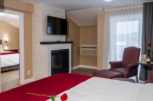 Postel nebo postele na pokoji v ubytování Hotel Bromont