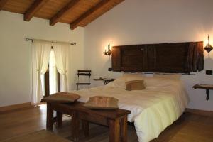 En eller flere senge i et værelse på Agriturismo Grassi Lunghi