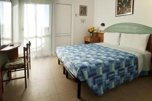 Postel nebo postele na pokoji v ubytování Hotel Giunchi