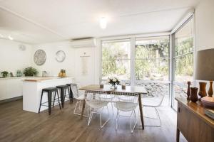 a kitchen and dining room with a table and chairs at Twiggy @ Anglesea in Anglesea