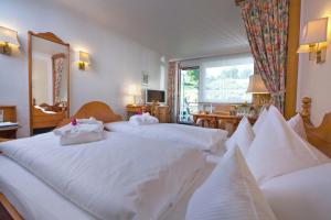 Postel nebo postele na pokoji v ubytování Hotel Garni Fürst von Waldeck
