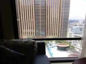 a living room with a view of a large window at FnF Suite @ Time Square in Kuala Lumpur
