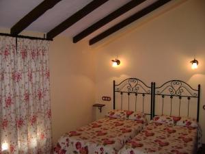 Łóżko lub łóżka w pokoju w obiekcie Apartamentos Trinidad