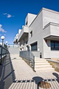 a building with a staircase in front of it at Apartamentos Turísticos Vicotel in Teruel