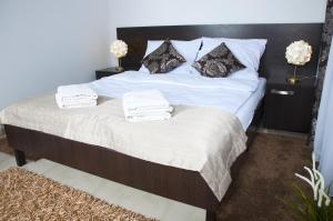 Posteľ alebo postele v izbe v ubytovaní Apartament IKAR blisko morza