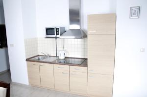 Kuchyňa alebo kuchynka v ubytovaní Apartament IKAR blisko morza