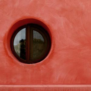 a window in the side of a red boat at La Joya del Valle de Ricote in Villanueva de Río Segura +37 photos