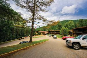 a white truck parked on a street in a town at Jenny Wiley State Resort Park in Prestonsburg