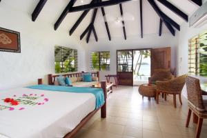 Кровать или кровати в номере Tropica Island Resort-Adults Only