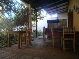 a wooden table and chairs on a patio at Las Cañas in Londres