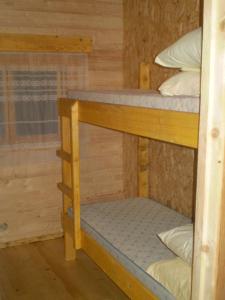 a couple of bunk beds in a room at Huntingbox in Purila