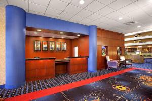 a lobby with blue columns and a waiting room at Capitol Plaza Hotel Jefferson City in Jefferson City