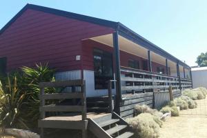 a purple house with a bench in front of it at Pebbles Beach Retreat in Cowes +9 photos