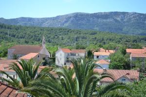 a view of a town with mountains in the background at Villa Agava in Vrboska
