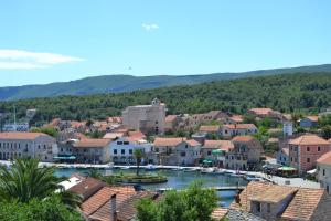 a view of a town with boats in the water at Villa Agava in Vrboska