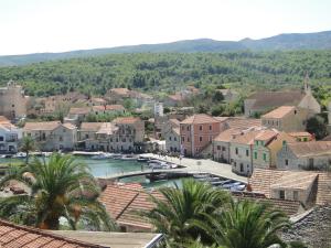 a town with a large swimming pool in a city at Villa Agava in Vrboska