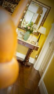 a view of a room with a table and a lamp at Somerton House Rooms Only in Belfast +25 photos