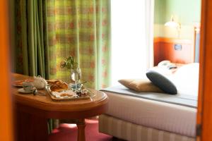 Postel nebo postele na pokoji v ubytování Arosio Hotel