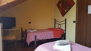 Postel nebo postele na pokoji v ubytování B&B La Tartaruga