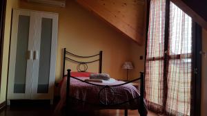Postel nebo postele na pokoji v ubytování B&B La Tartaruga