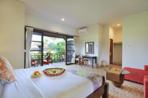 Posezení v ubytování Sarin Ubud Suites by Pramana Villas