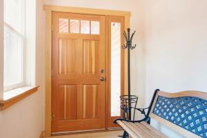 a wooden door in a room with a bench at North Shore - Golden Pine in Kings Beach