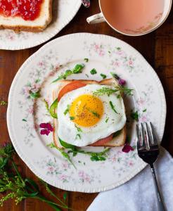 a breakfast plate with an egg on top of bread at Rhino Creek Estate in Bloemfontein